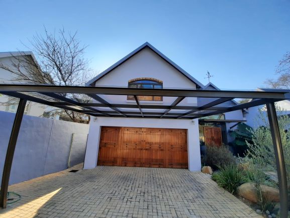 Steel and polycarbonate roofing carport structure built by BM Plumbsteel Solutions in Fourways
