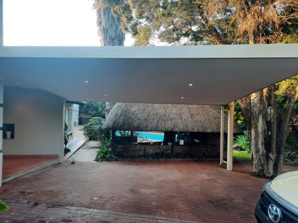 Steel carport with a closed ceiling and downlights installed in Kempton Park